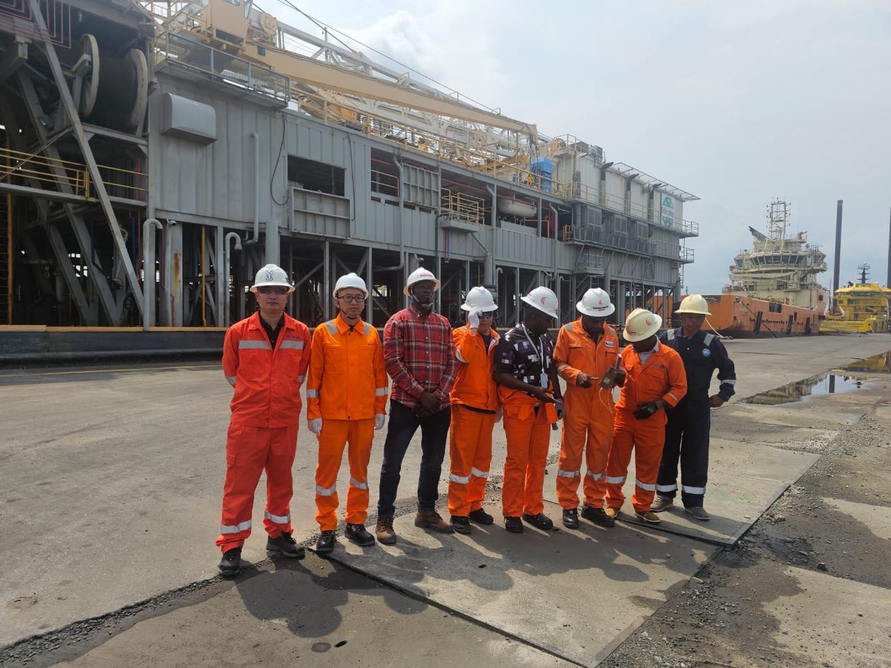 Drilling professionals reviewing equipment on a rig